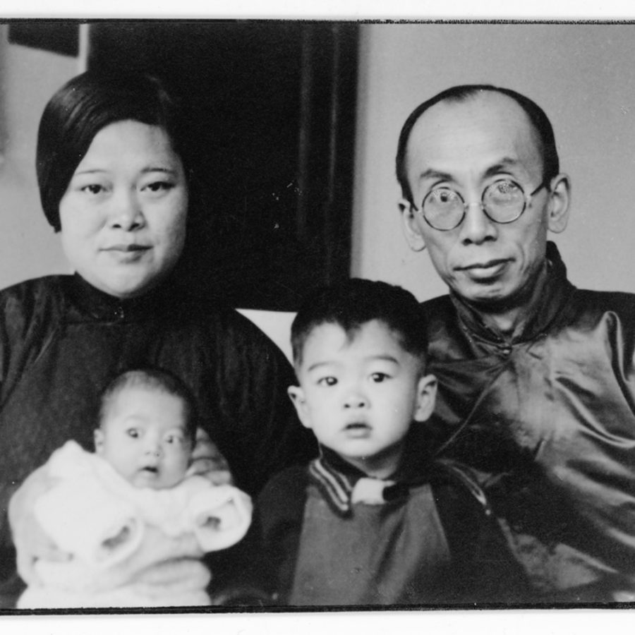 Black and white photo of a young family of four