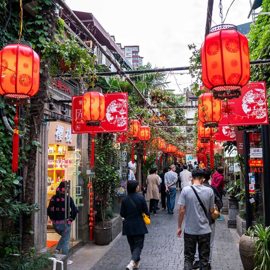 A street in Shanghai is filled with red lanterns.