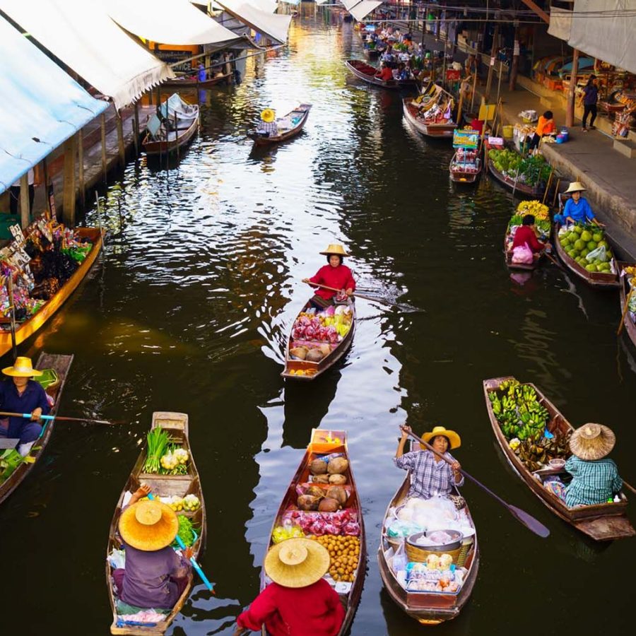 Boats sail down one of Bangkok's floating markets