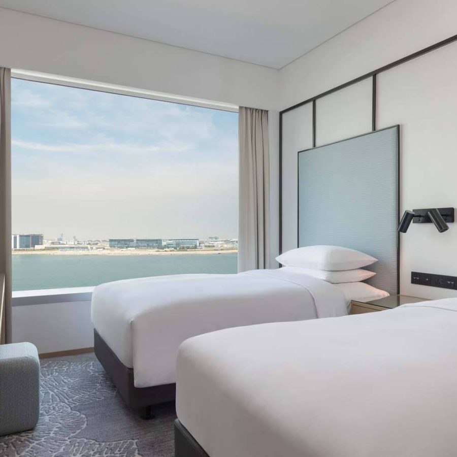 Interior of a traditional ocean view twin bedroom at Four Points by Sheraton hotel in Hong Kong