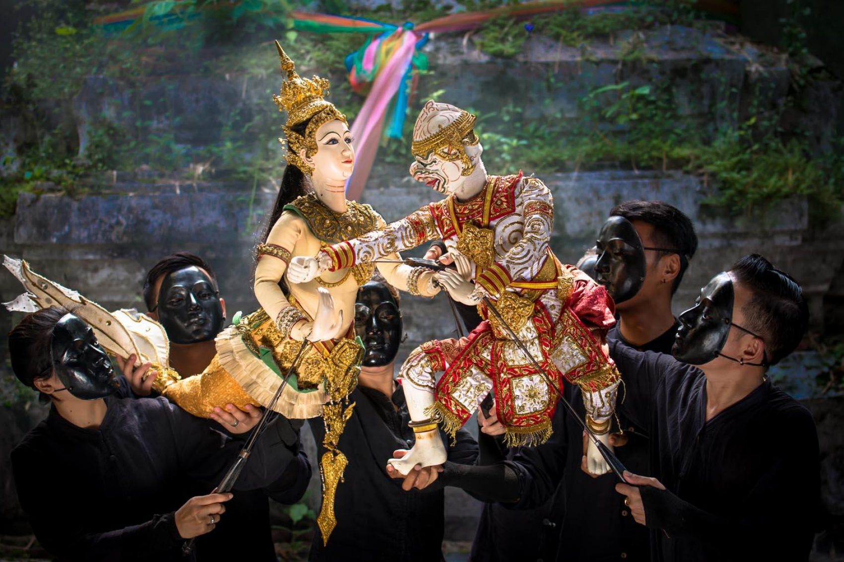 Thai puppets engage with one another during a Bangkok puppet show
