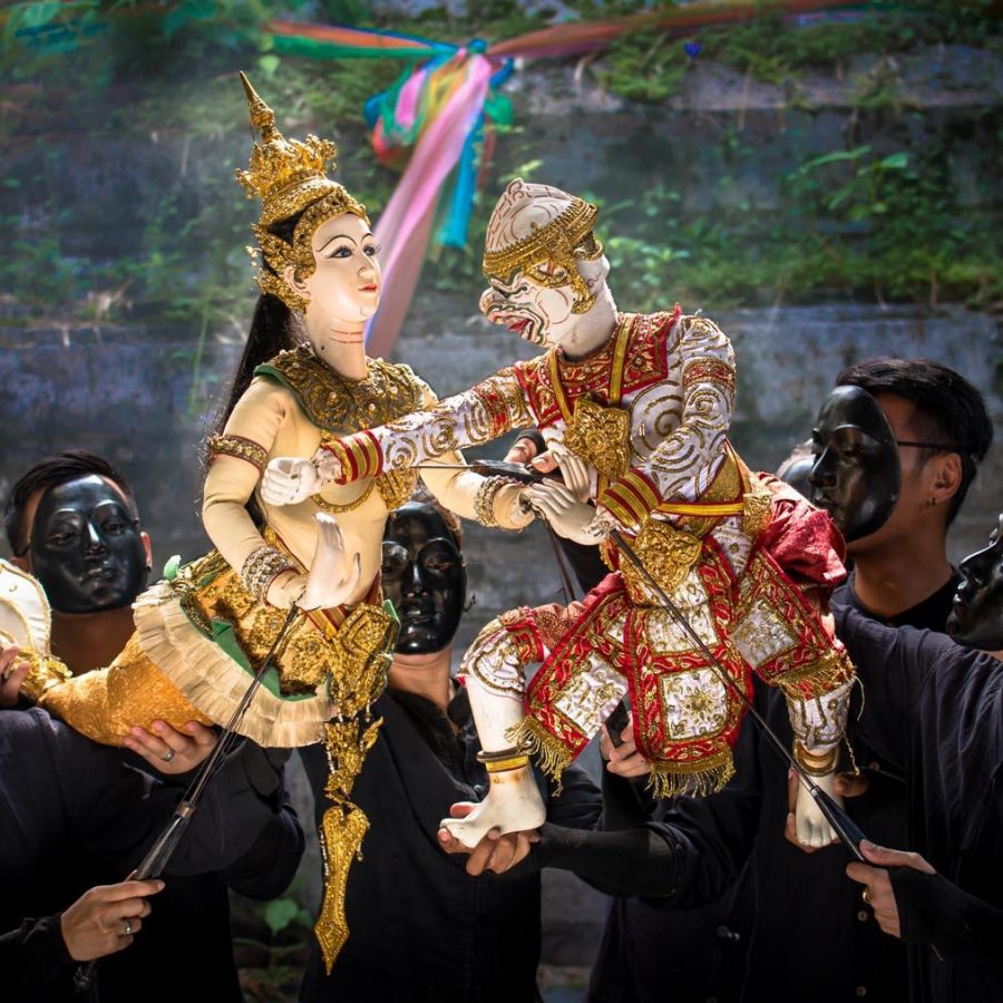 Thai puppets engage with one another during a Bangkok puppet show
