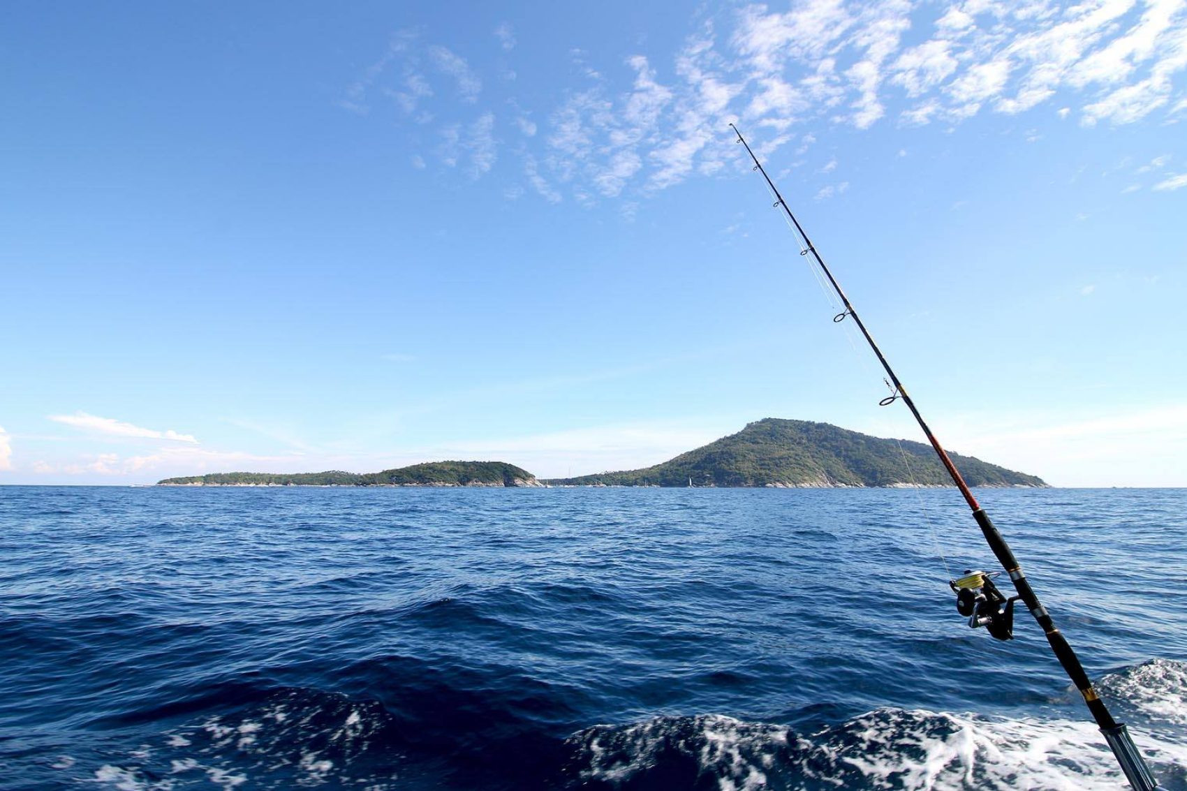 Fishing tools on the boat under the sea and clear sky at Racha Island in Phuket, Thailand
