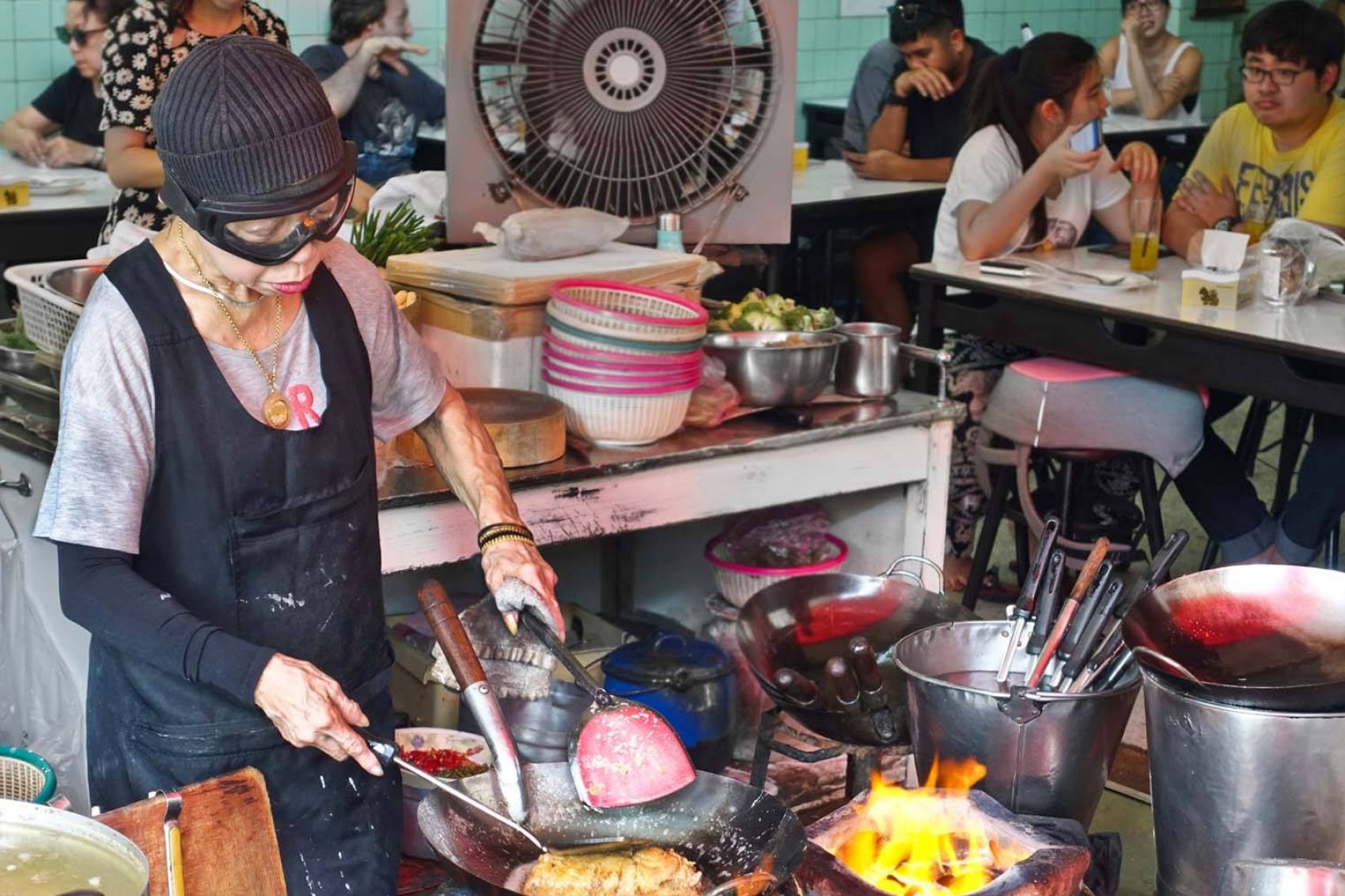 Jay Fai’s roadside restaurant - making a crab omelette. Credit: Shutterstock