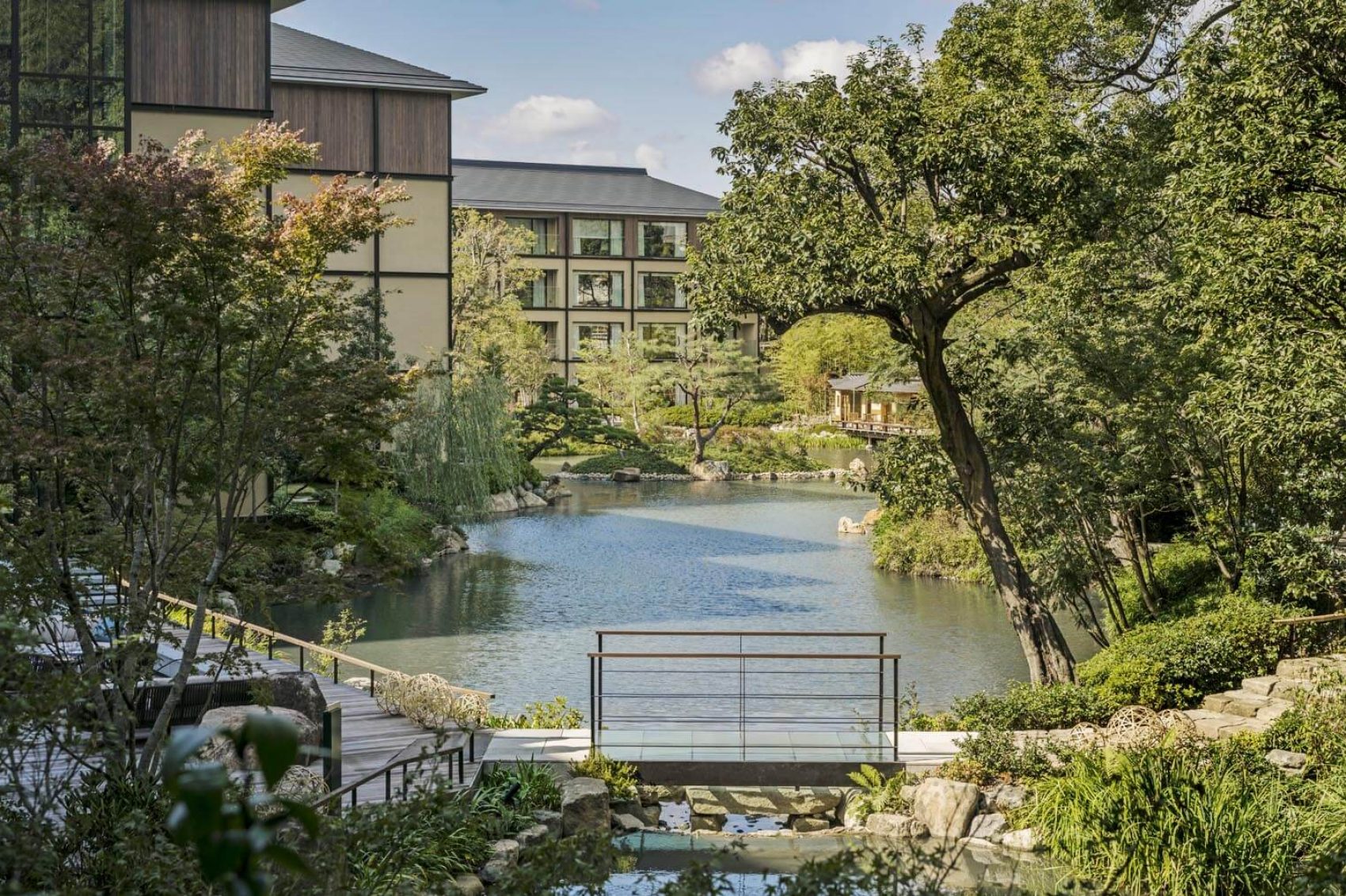 Four Seasons Hotel Kyoto features a 12th-century pond garden with cherry and maple trees