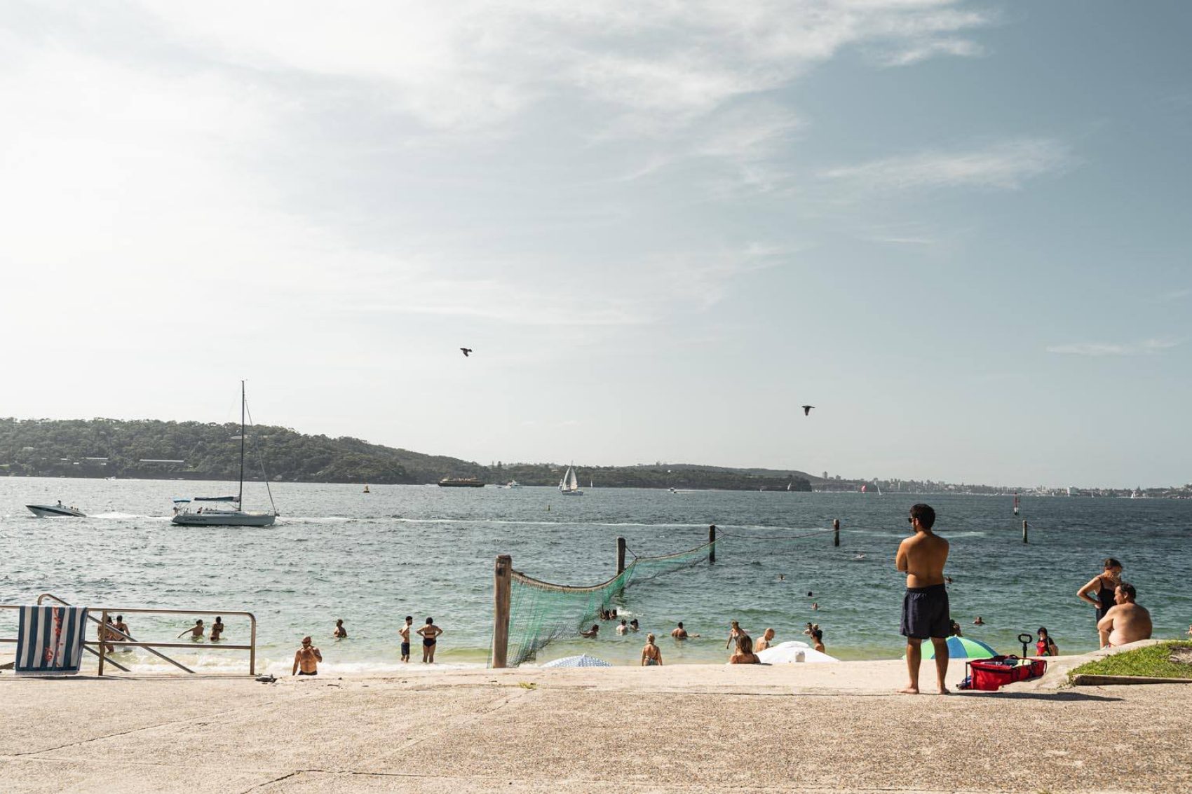 People taking a walk through Sydney at Shark Beach in Nielsen Park. Credit: Nick Clark Creative/Shutterstock