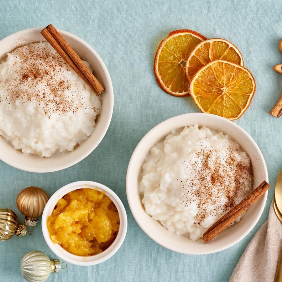 Norwegian comforting Christmas dish risengrynsgrøt: a creamy rice porridge sprinkled with cinnamon, sugar and vanilla 