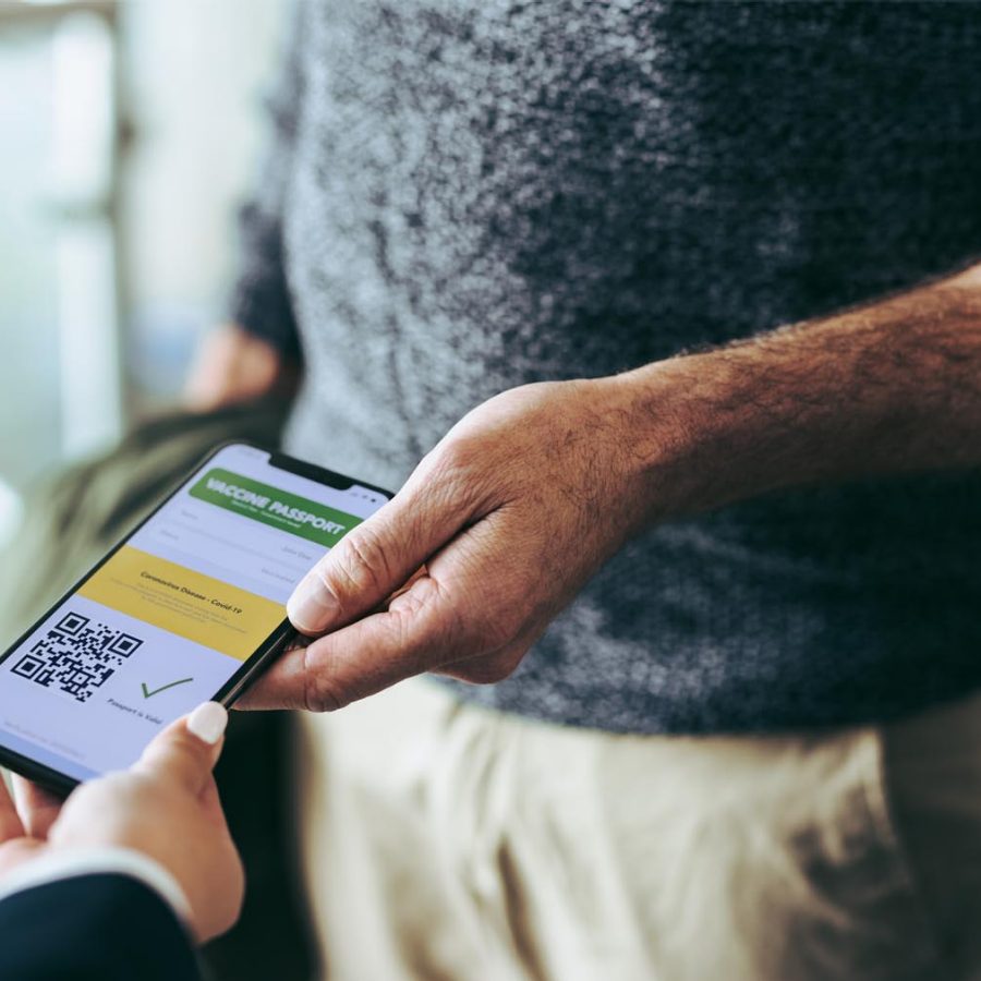 Man showing phone with Covid-19 related information on. Credit: iStock