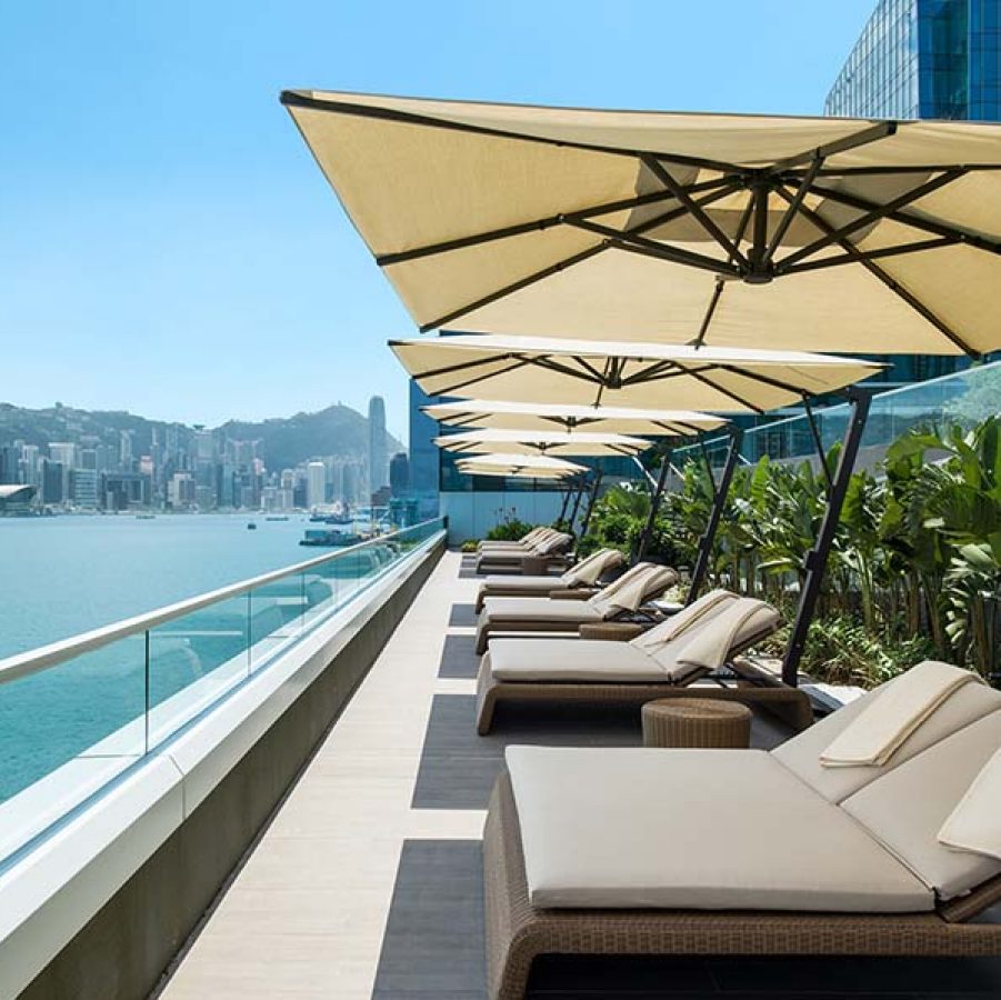 Lounge chairs at Kerry Hotel Hong Kong by the pool
