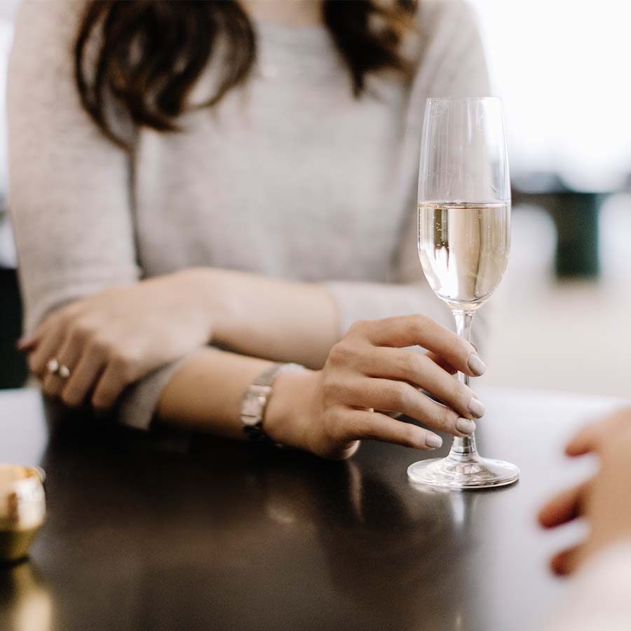 Woman holding a glass of champagne