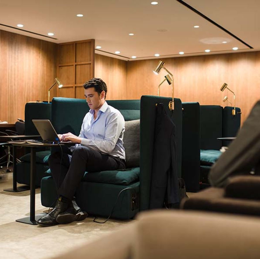 Man working in business lounge