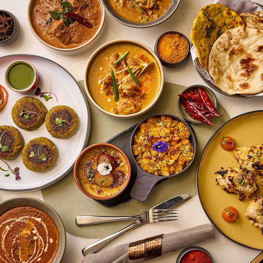 Table full of curry dishes