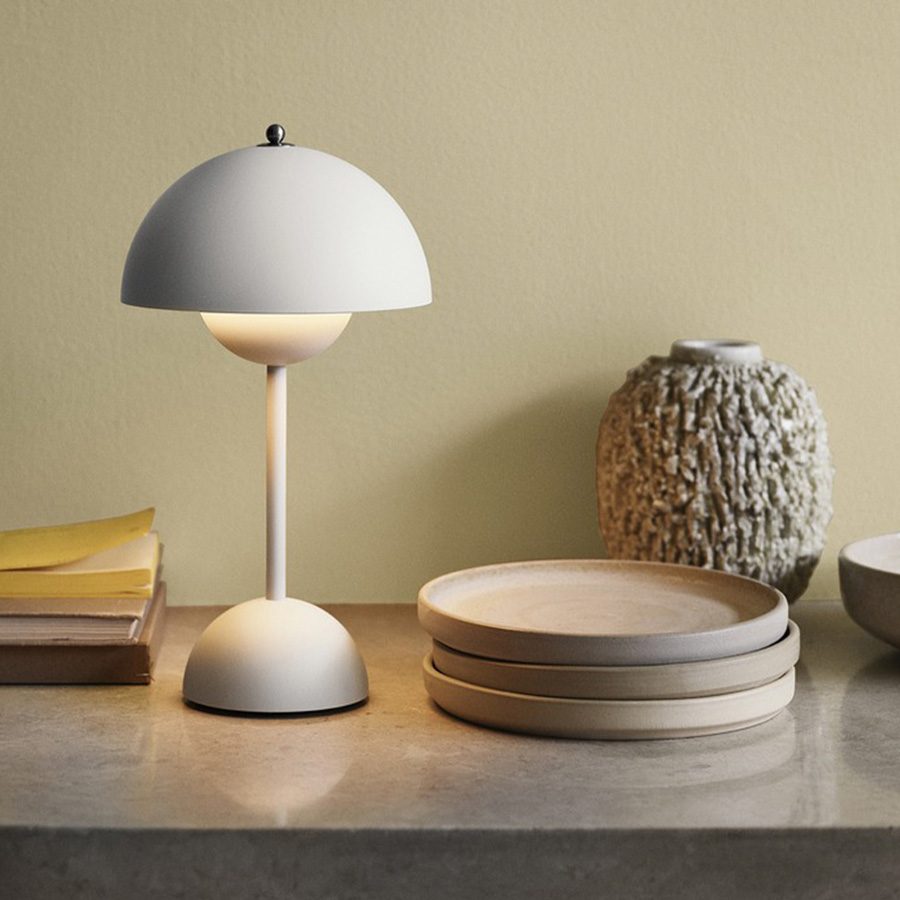 Contemporary lamp next to some plates