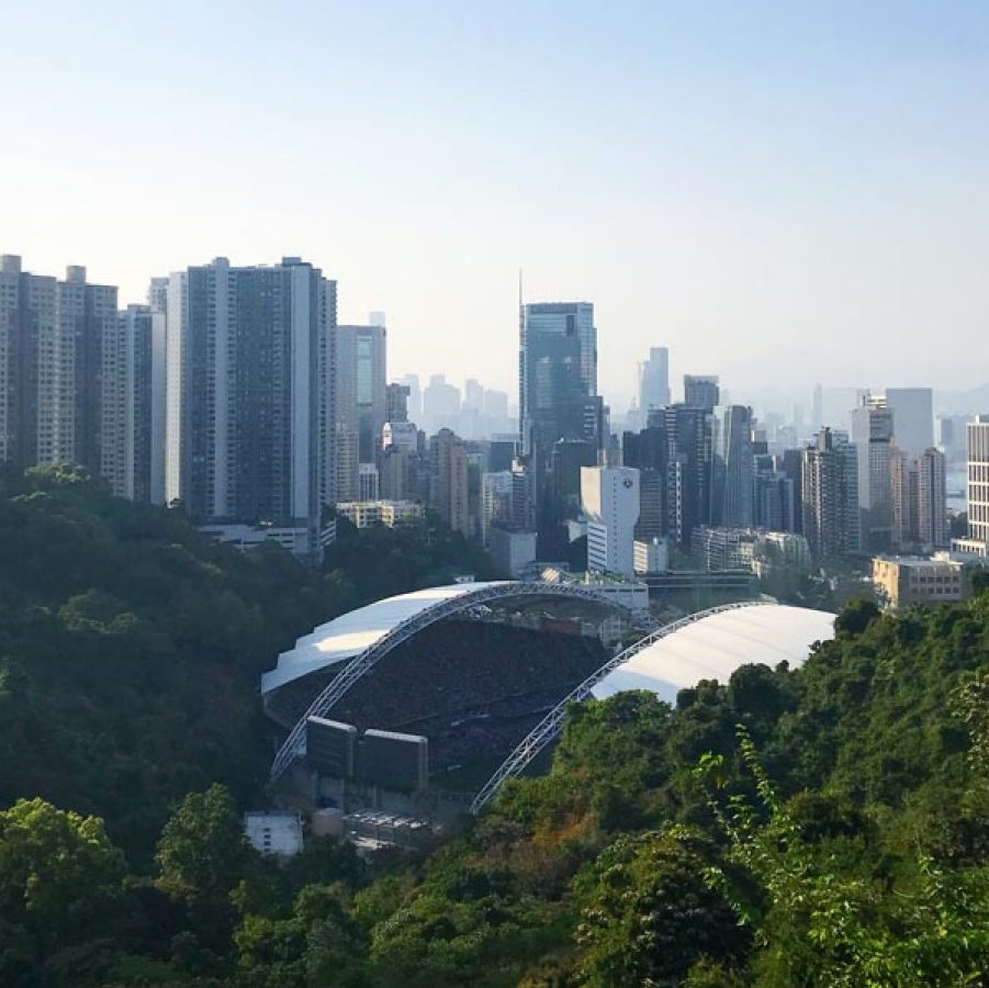 Hong Kong stadium with Hong Kong skyline behind it