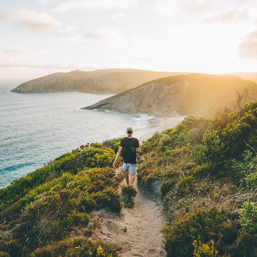 Man hiking by water