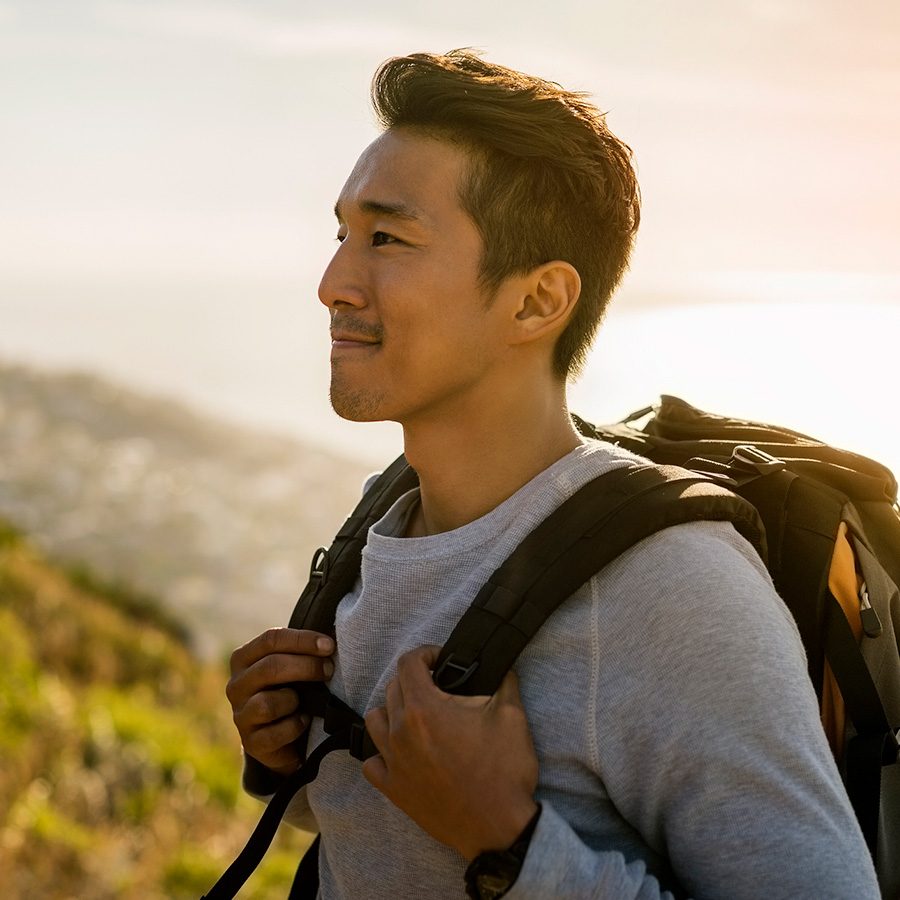 Man outside wearing backpack