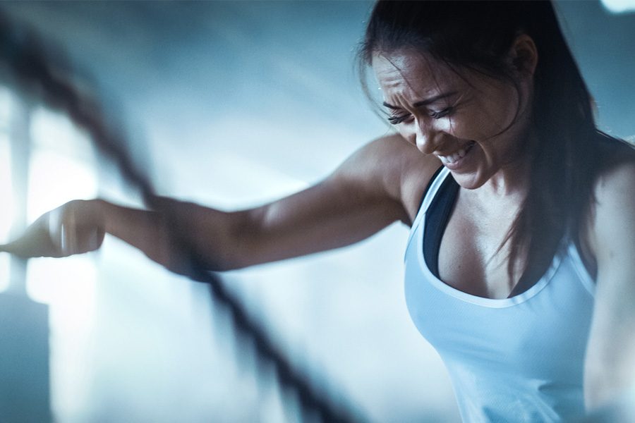 Woman working out using ropes