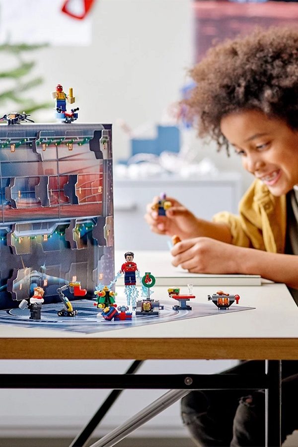 Boy playing with Lego advent calendar