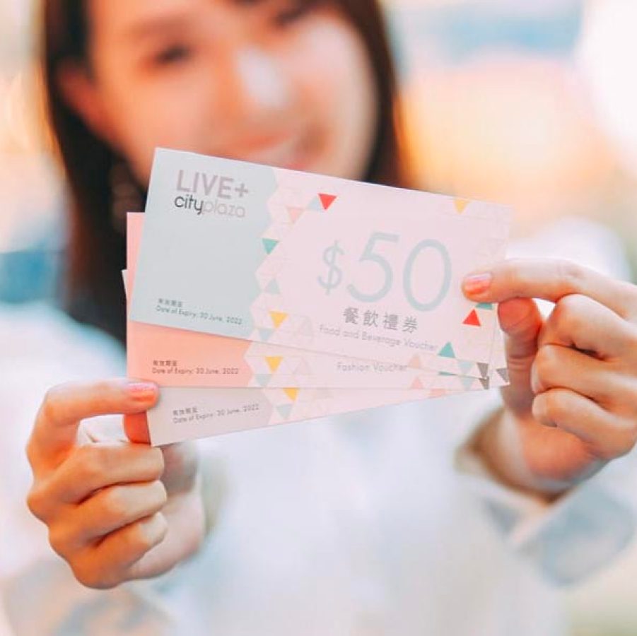 Woman holding Cityplaza vouchers