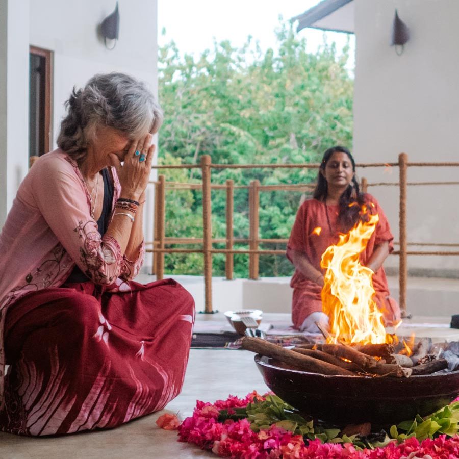 Women sat around fire