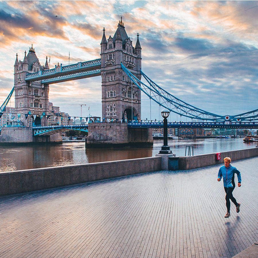 Runner going past Tower Bridge, London, UK. Credit: Getty images