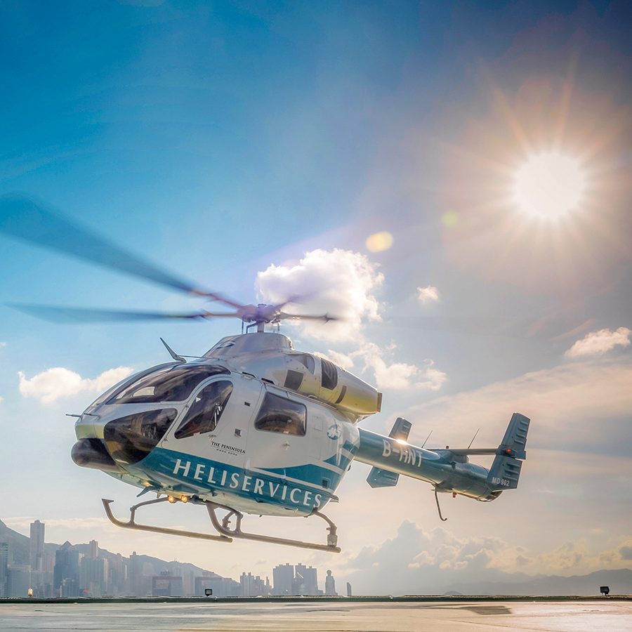Helicopter taking off in front of Victoria Harbour 