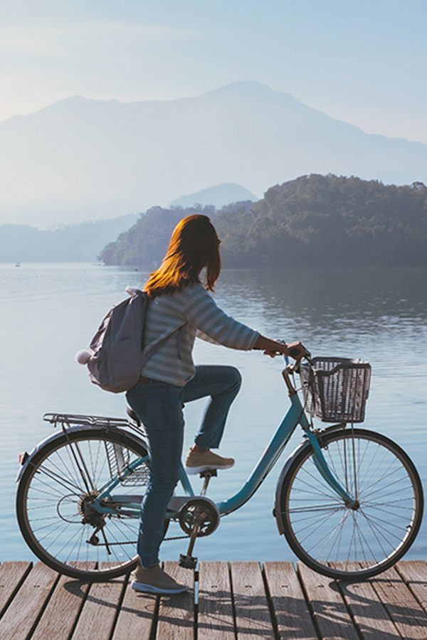 Woman cycling in Taipei Credit: Kitzcorner