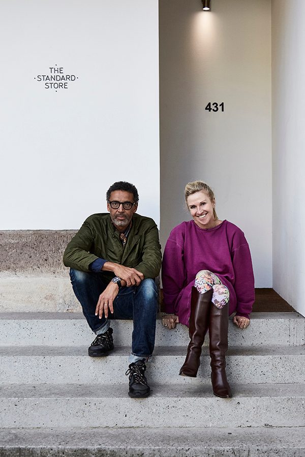 The Standard Store founders Nicola and Orlando Reindorf sitting on the steps of the shop in Surry Hills, Sydney, Australia