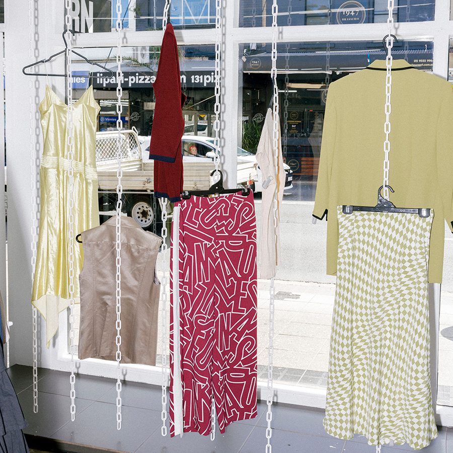 A collection of vintage clothes hanging at the display window of Uturn store during daytime facing the street in Surry Hills, Sydney, Australia