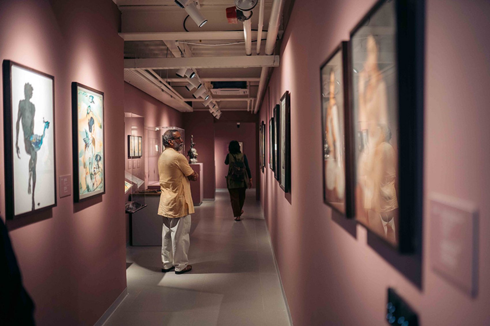 Man looking at artwork. Courtesy image