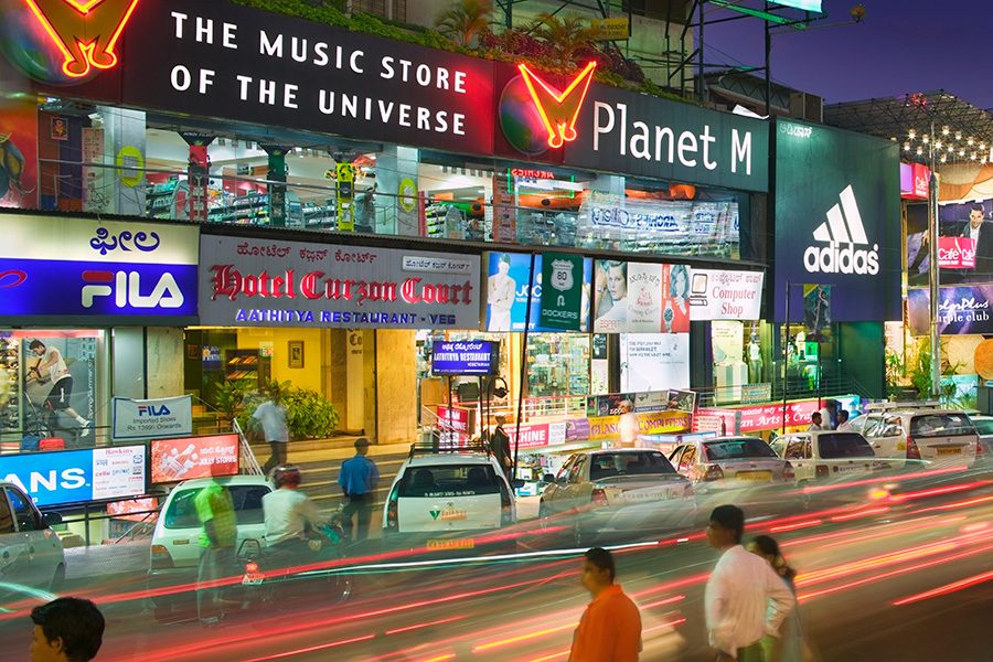 Sports stores on a street at night. Courtesy image 