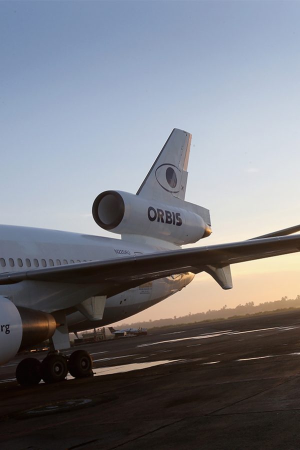 A closeup of the wing of an ORBIS aircraft 