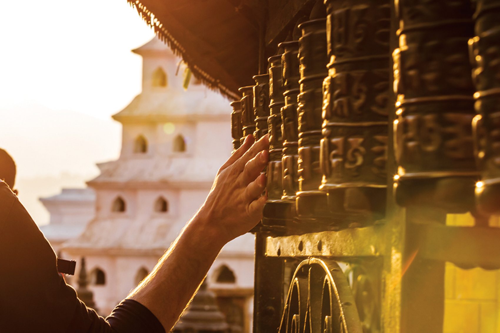 Spin prayer wheels at Boudhanath Stupa, Kathmandu. Credit: Getty Images