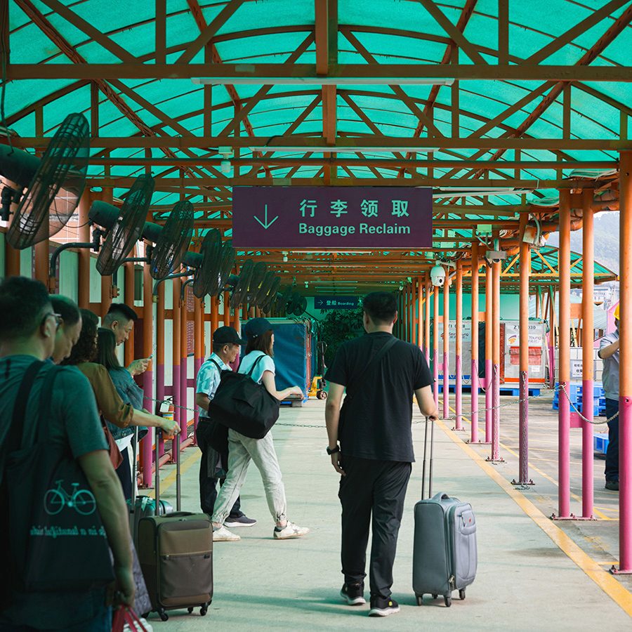 People are walking with their luggages