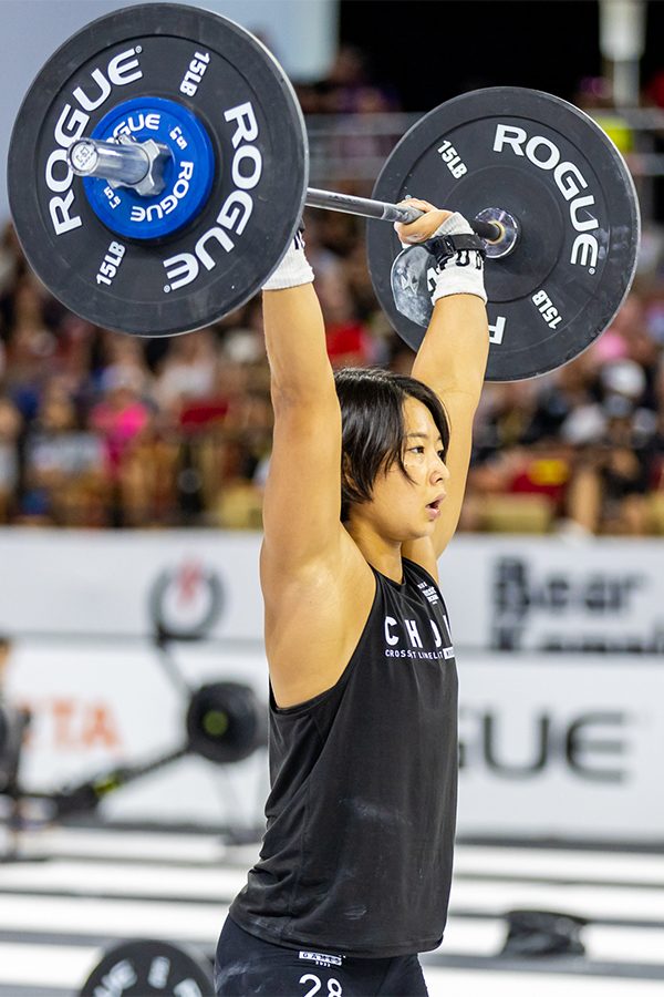 A woman lifting a barbell at CrossFit Games