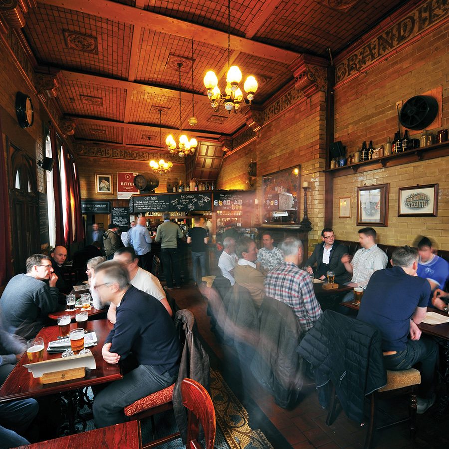 A pub interior filled with people 