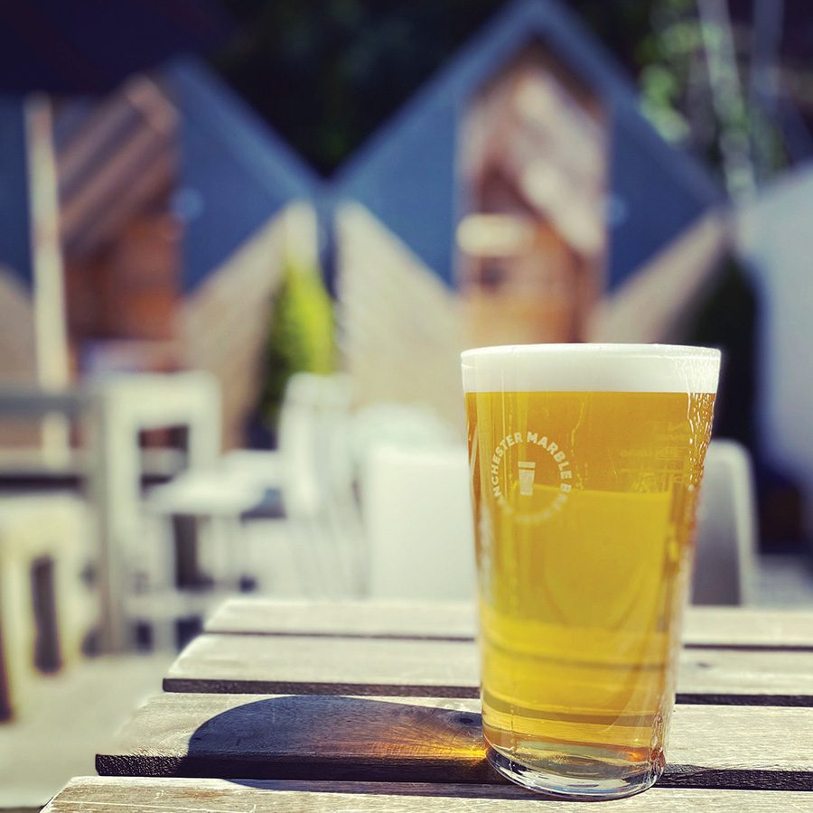 A pint of beer on an outside table