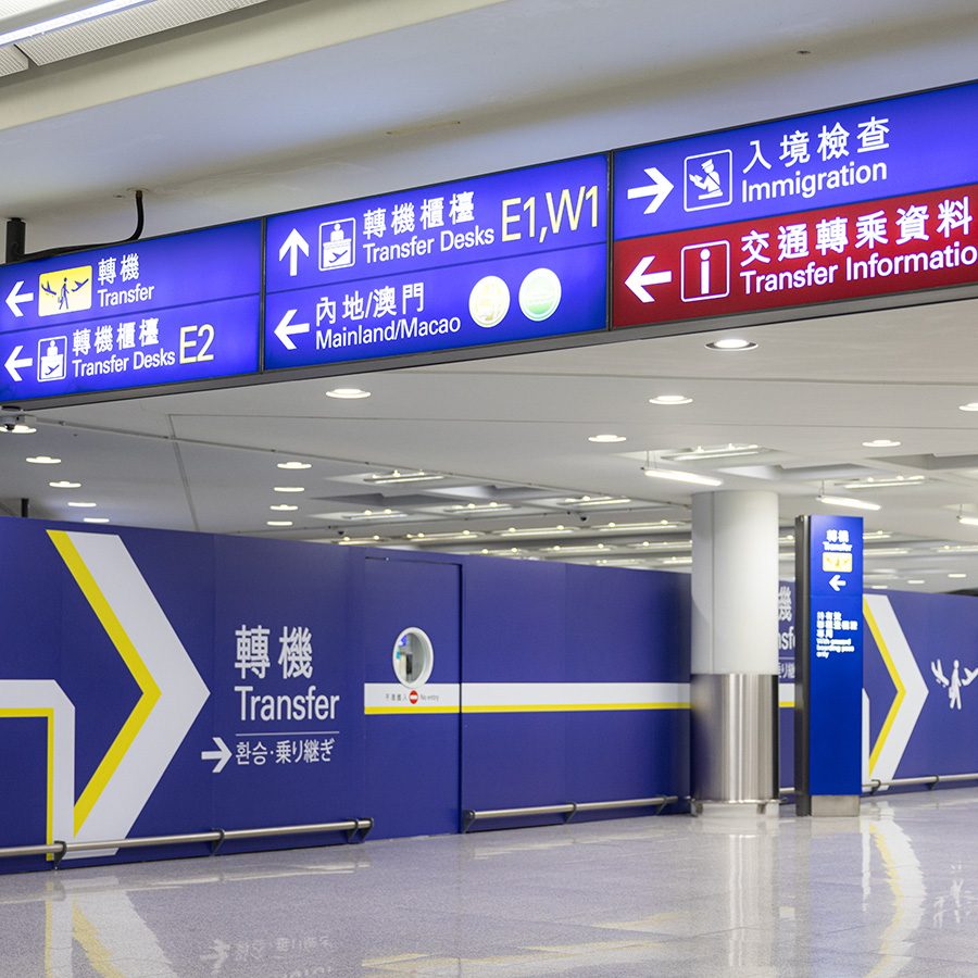 Airport signs to transfer desks in HKIA