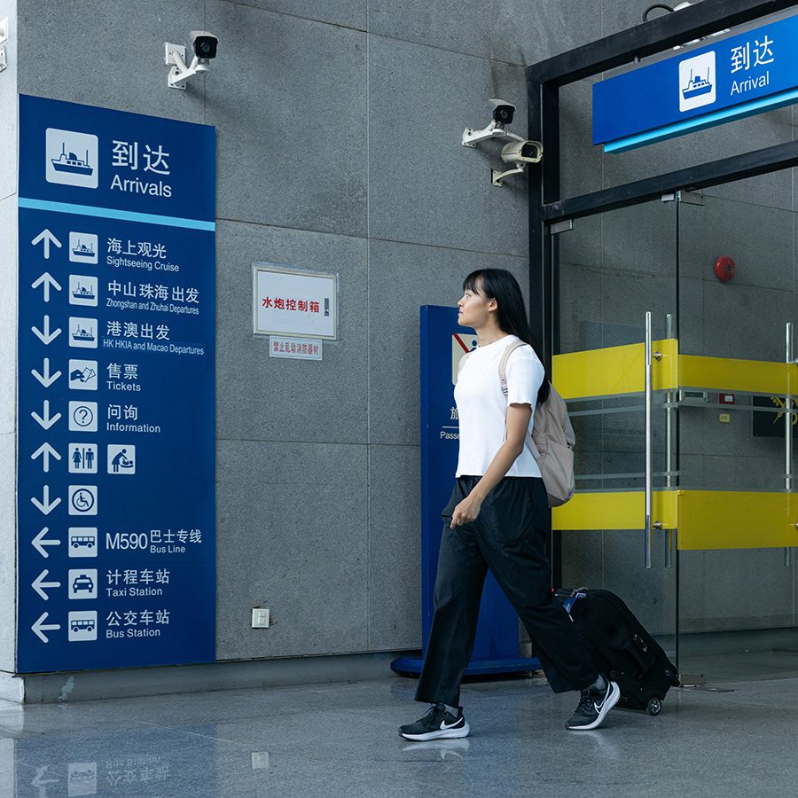 Woman exiting Shenzhen airport ferry terminal