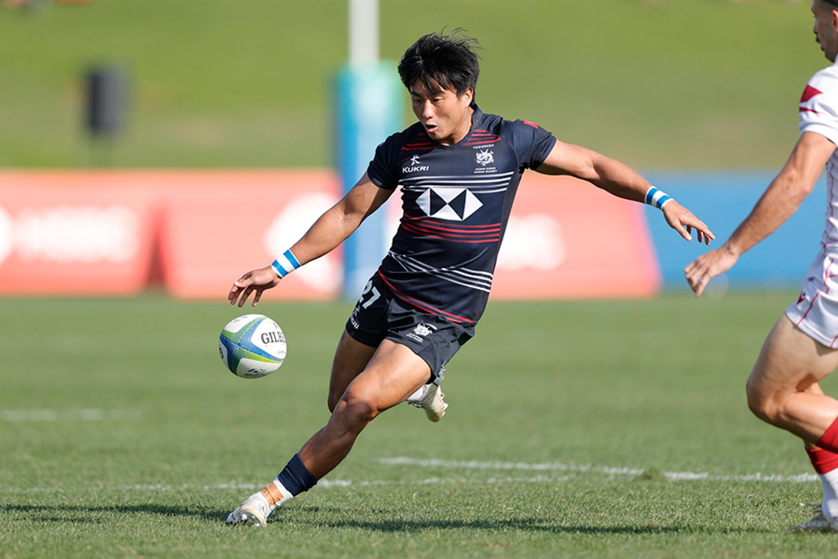 Cado Lee kicking a rugby ball