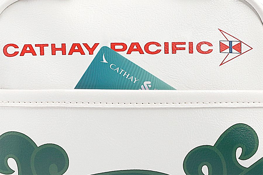 Close up of the standard chartered cathay mastercard in the pocket of the cathay bag