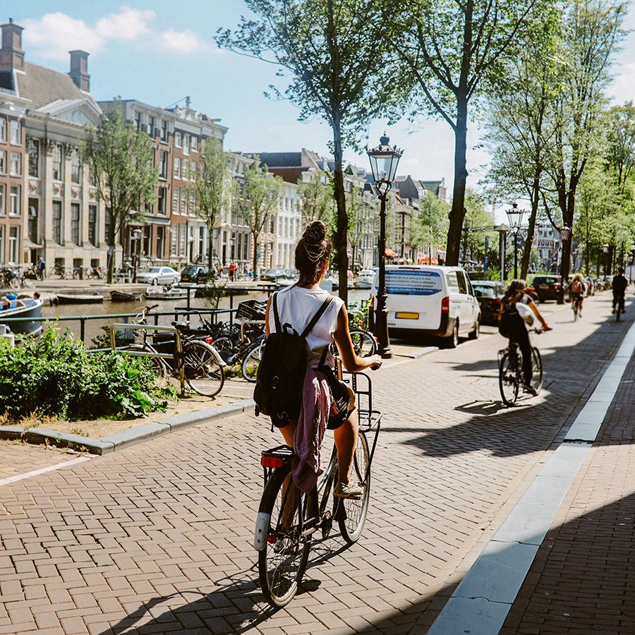 Woman cycling in Amsterdam