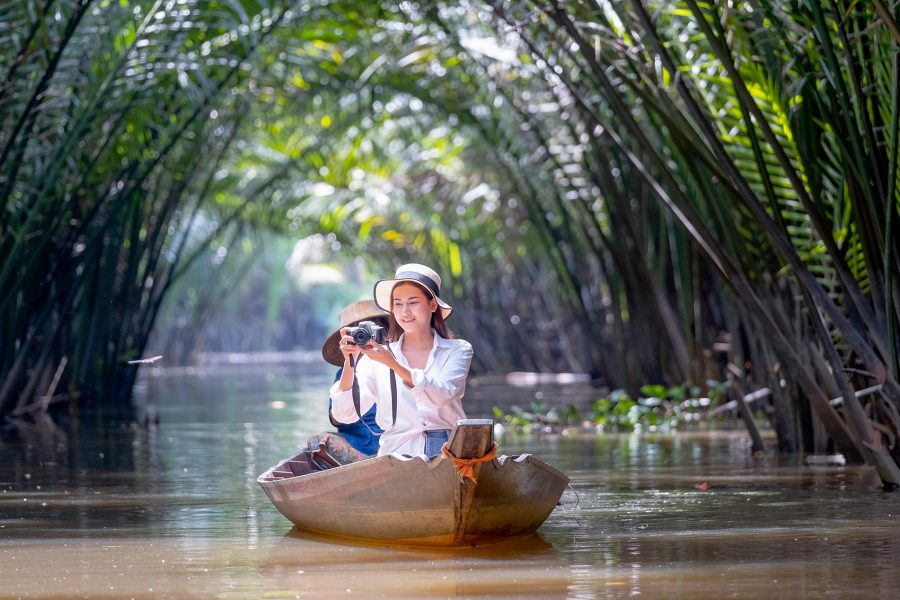 Woman on boat in mangrove