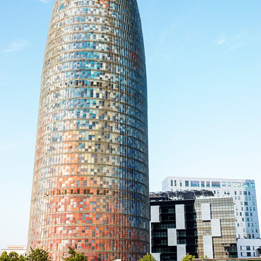 Agbar Tower exterior with park and people picnicking