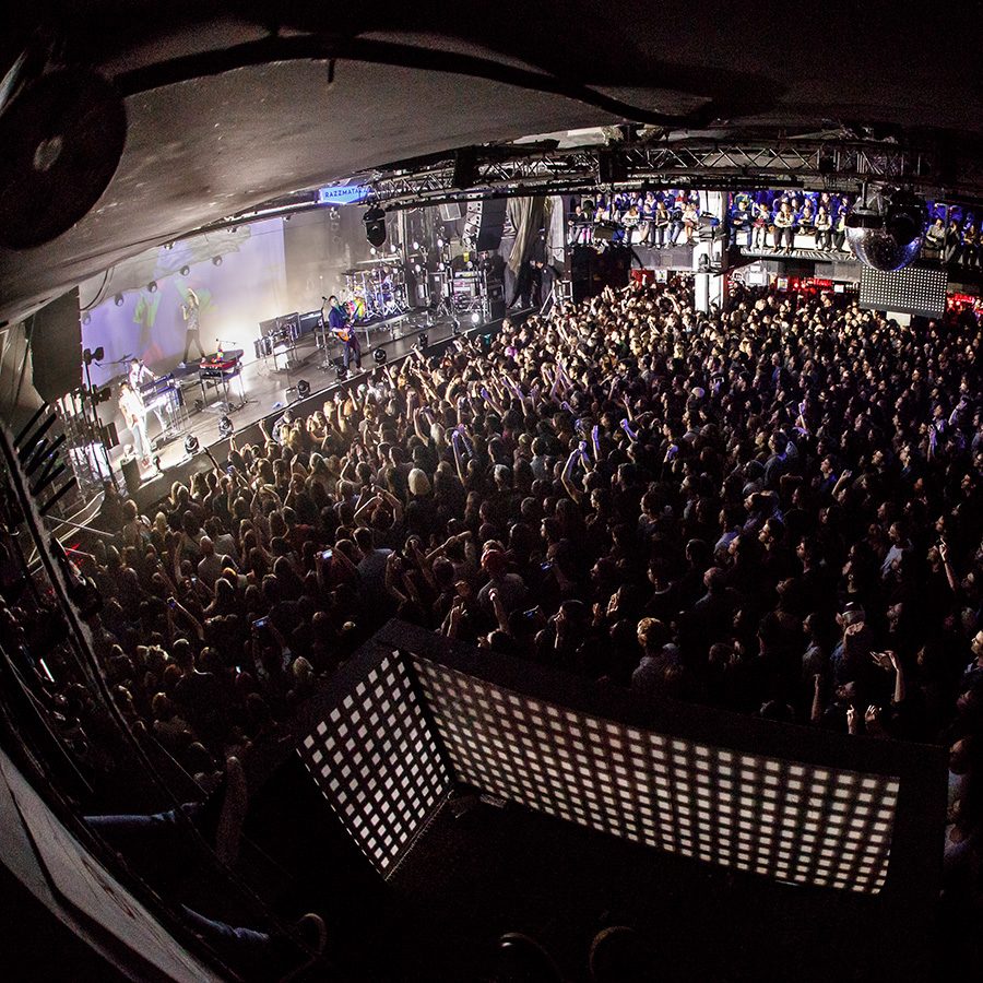 Concert venue Razzmatazz with band playing and crowd enjoying the music