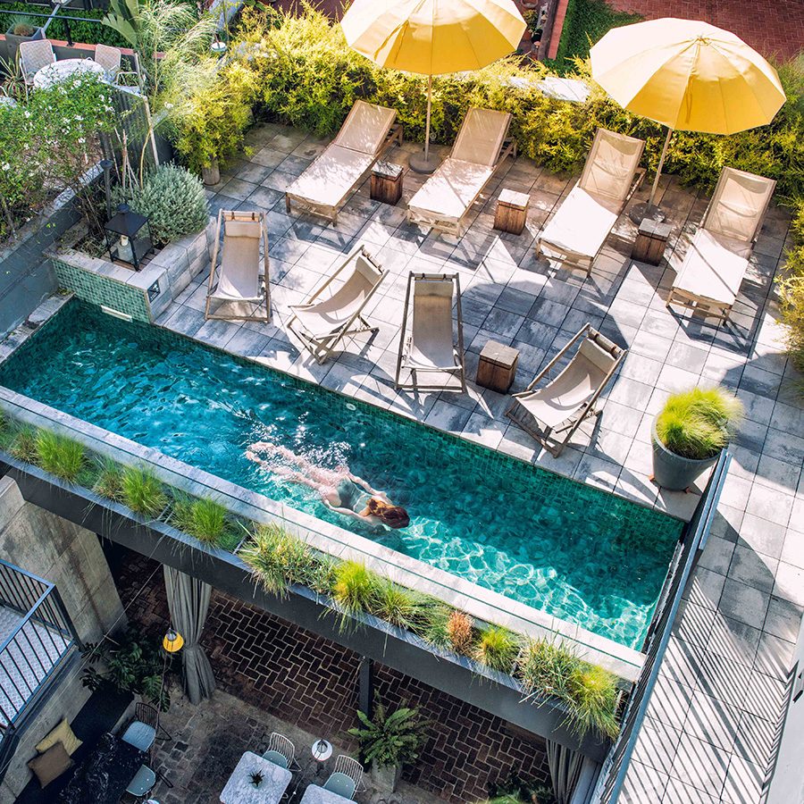 Hotel Brummell's miniature pool with deck chairs and sun umbrellas