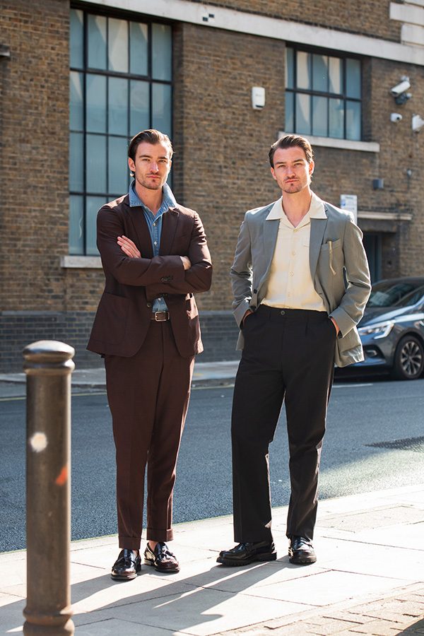 Two men standing wearing dress shoes