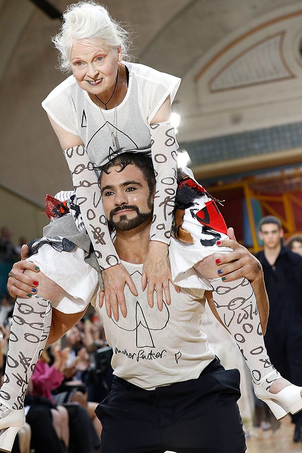 Vivienne Westwood and model on runway wearing white