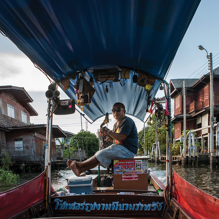 Man on boat in Bangkok