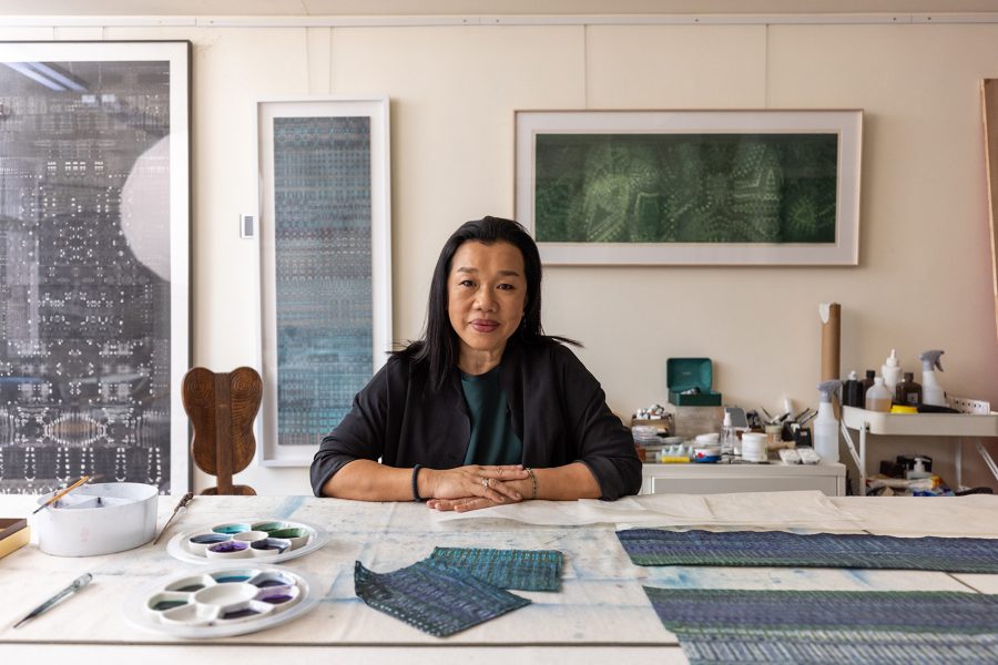 Gallery in the skies artist Fan Yan at her work table